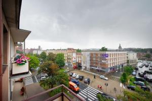 a view of a city street with cars and buildings at Blue Apartment Rajska in Gdańsk