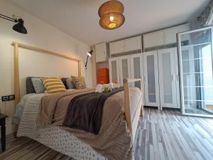 Łóżko lub łóżka w pokoju w obiekcie Apartamento CANELA
