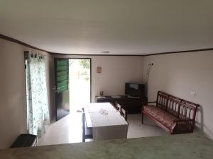 a living room with a couch and a table at Depto 4 in Sierra de la Ventana