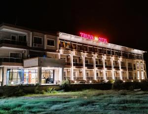 a hotel with a neon sign on top of it at TRUVA LİFE OTEl in Samandağı