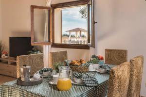 a table with a green and white checkered table cloth at Son Sea Villa in Campos