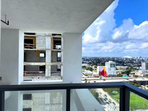 an apartment balcony with a view of a city at Prime location: Luxury Condo at brickell in Miami