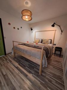 Łóżko lub łóżka w pokoju w obiekcie Apartamento CANELA