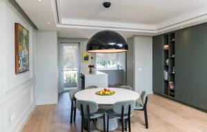 a dining room with a table and chairs at 401 Dovenby in Cape Town