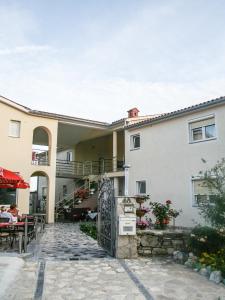 a building with a gate in front of it at Guest House Croatia in Fažana