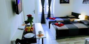 a living room with a couch and a table at Pula-Center Apartments and Rooms in Pula +75 photos