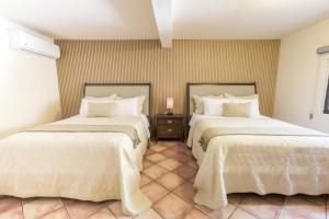 Postel nebo postele na pokoji v ubytování Hotel Posada Terranova
