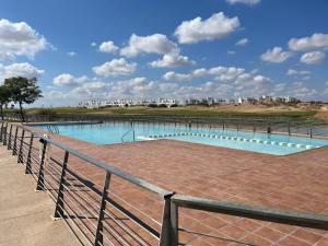 a swimming pool with a fence around it at Villa Eric in Roldán