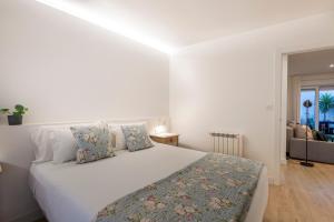Ένα ή περισσότερα κρεβάτια σε δωμάτιο στο APARTAMENTO TURISTICO A 140 M PLAYA CANELIÑAS- Portonovo- 2 HABIT 4-6 pax 102