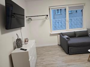 Un televizor și/sau centru de divertisment la Ferienwohnung in Krefeld Apartment Krefeld City