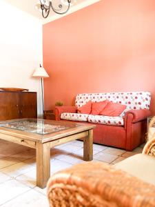 a living room with a couch and a coffee table at Casa Coronel in Mendoza +31 photos
