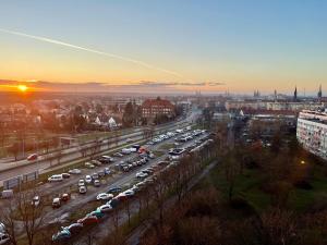 a parking lot filled with cars in a city at Apartament Galactica in Legnica
