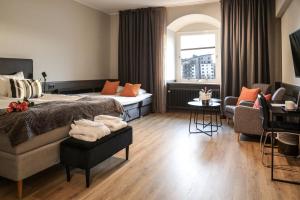 Postel nebo postele na pokoji v ubytování First Hotel Statt Örnsköldsvik