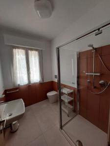 a bathroom with a shower and a sink and a toilet at Dimora Fonte San Pietro in Civitanova Marche