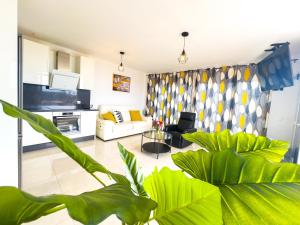 a living room with a couch and a table at Villa Callao Salvaje 3 BR Heated Pool & Stunning Views in Adeje