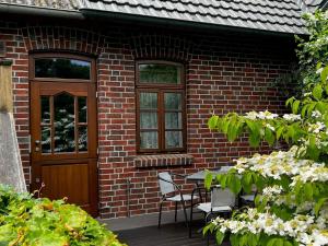 Zahrada ubytování Gästehaus Peerhus Dönsel - Deensten + 7 fotografií