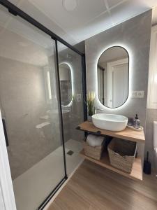 a bathroom with a sink and a mirror at Apartamento La Gata del Cabo in El Cabo de Gata +29 photos
