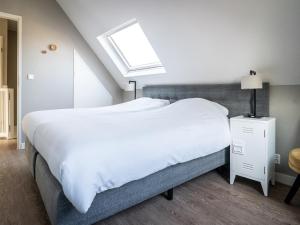 Postel nebo postele na pokoji v ubytování Bungalow in Texel near De Slufter Reserve