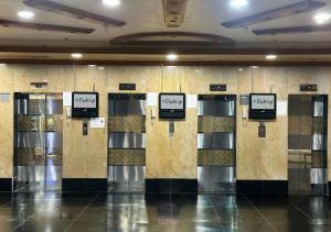 a row of lockers in a building with signs on them at Familiar Partition Room In Tecom Near ICM Metro in Dubai