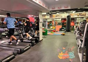 a group of people running on treadles in a gym at Familiar Partition Room In Tecom Near ICM Metro in Dubai