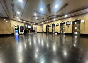 a large empty room with ailed floor in a building at Familiar Partition Room In Tecom Near ICM Metro in Dubai