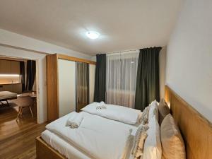 Posteľ alebo postele v izbe v ubytovaní NĀVA PLACE Your Second Home in the Alps