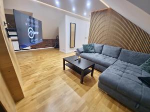 a living room with a couch and a table at Ferienwohnung JP-Home in Herne