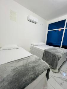 Postel nebo postele na pokoji v ubytování Moderna VIP Vereda Real