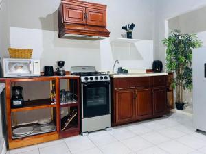 a kitchen with a stove and a sink at Puerta Azul in Tampico