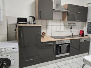 O bucătărie sau chicinetă la Ferienwohnung in Krefeld Apartment Krefeld City