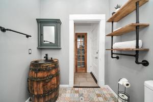 a hallway with a large wooden barrel in a room at Gulf Siesta Vacation Lofts in Galveston +149 photos