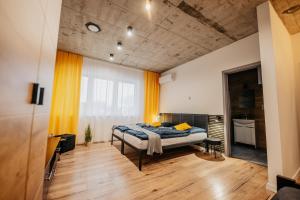 Postel nebo postele na pokoji v ubytování HM Apartments