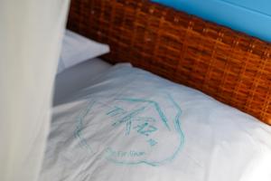 Postel nebo postele na pokoji v ubytování TIKAZmg CANNELLE