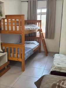 Кровать или кровати в номере Recanto do Leco - Praia da Armação