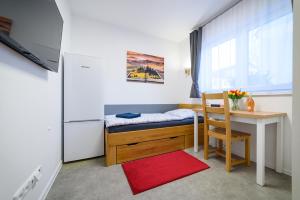 Posteľ alebo postele v izbe v ubytovaní Apartmány Volavka 2