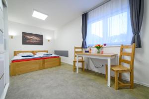 Posteľ alebo postele v izbe v ubytovaní Apartmány Volavka 2