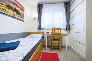Posteľ alebo postele v izbe v ubytovaní Apartmány Volavka 2