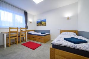 Posteľ alebo postele v izbe v ubytovaní Apartmány Volavka 2