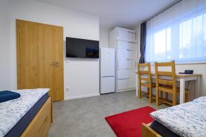 Posteľ alebo postele v izbe v ubytovaní Apartmány Volavka 2