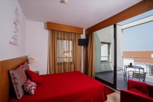 Cama ou camas em um quarto em Hotel Jose Alberto