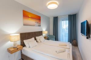 Katil atau katil-katil dalam bilik di Lakeside Garden Apartment +18 gambar
