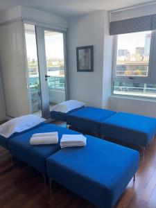 Ένα ή περισσότερα κρεβάτια σε δωμάτιο στο Yacht Puerto Suites +35 φωτογραφίες