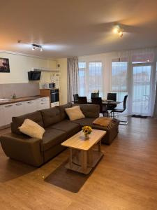 a living room with a couch and a table at Home Guest - Apartment 1 in Oradea