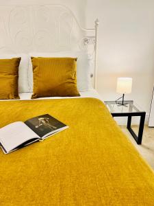 a bedroom with a bed with a book on it at Alcantara House in Southampton +33 photos