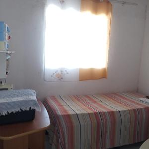 Ένα ή περισσότερα κρεβάτια σε δωμάτιο στο Casa da Cícera