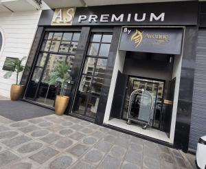 a store front of a building with windows and a sign at AS Premium By Soho Hotels Maarif in Casablanca