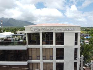 a building with a sign that reads the united hotel and resort at Villa Isabel Hotel in Sorsogon