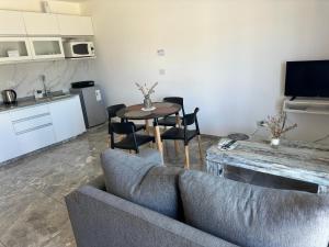 a living room with a couch and a table at ESPACIO UNO d in Belén de Escobar