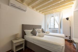 Ένα ή περισσότερα κρεβάτια σε δωμάτιο στο Piazza Navona Classy & Large Apartment