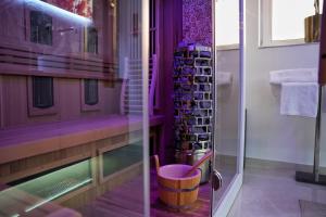 a bathroom with a walk in shower and a wine rack at Wellness-Oase in Kerkrade +27 photos